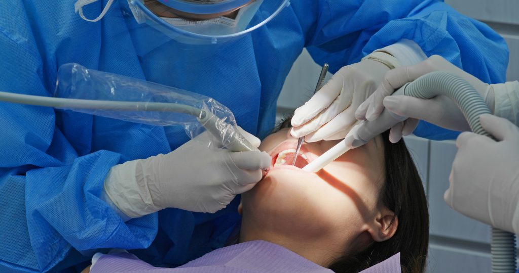 Woman undergo dental scaling treatment